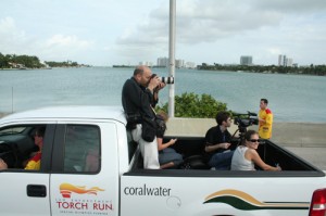 Me riding in the back of pick-up while taping the Special Olympics torch run on Jan. 13. We were driving on the McArthur Causeway over Biscayne Bay. Photo by Andrea Ballocchi